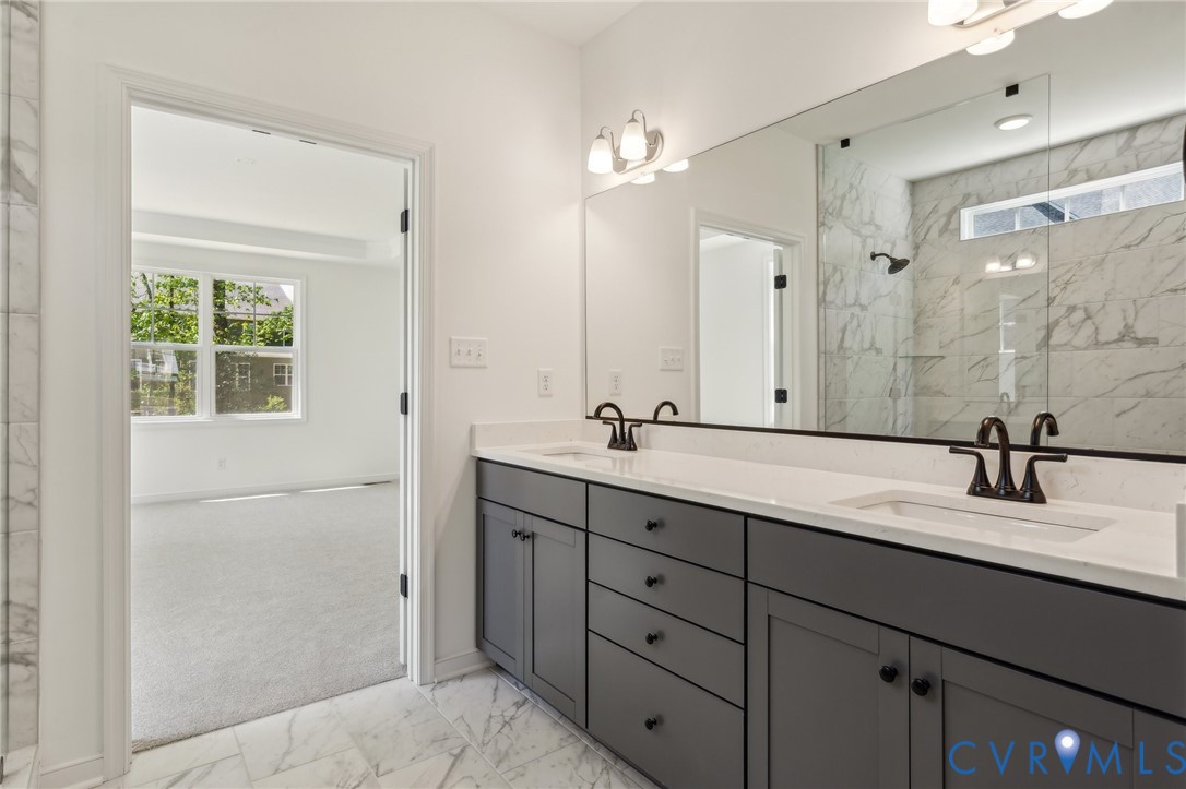 3953 Robins Ridge Drive Moseley, VA 23120 - Photo 11 of 25 a bathroom with double vanity sink and a mirror