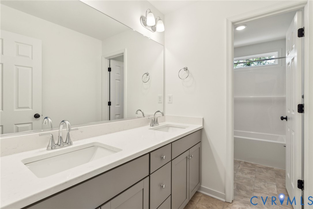 3953 Robins Ridge Drive Moseley, VA 23120 - Photo 18 of 25 a bathroom with a sink and a mirror