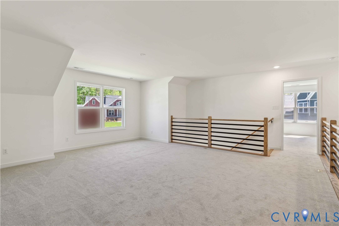 3953 Robins Ridge Drive Moseley, VA 23120 - Photo 19 of 25 a view of empty room with windows and fireplace