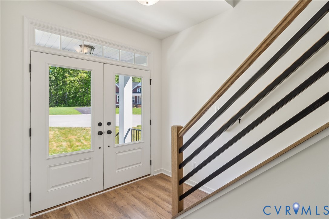3953 Robins Ridge Drive Moseley, VA 23120 - Photo 5 of 25 a view of a entryway with wooden floor and cabinet
