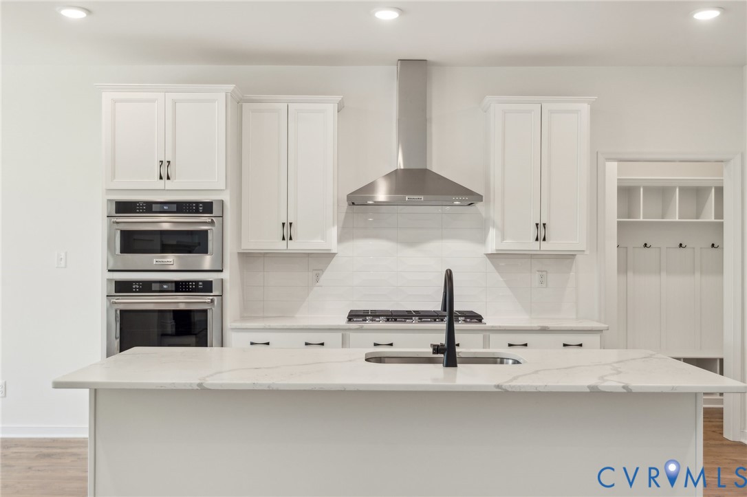3953 Robins Ridge Drive Moseley, VA 23120 - Photo 7 of 25 a kitchen with granite countertop a stove and a refrigerator