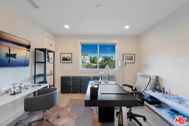 a workspace with furniture and window