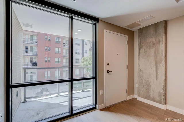 a view of a chairs and table in the roof deck