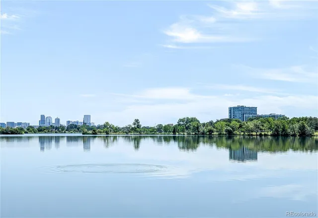 a view of a lake with houses in outdoor space and seating