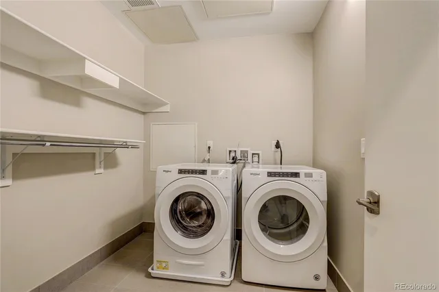 a view of sitting area with furniture and city view