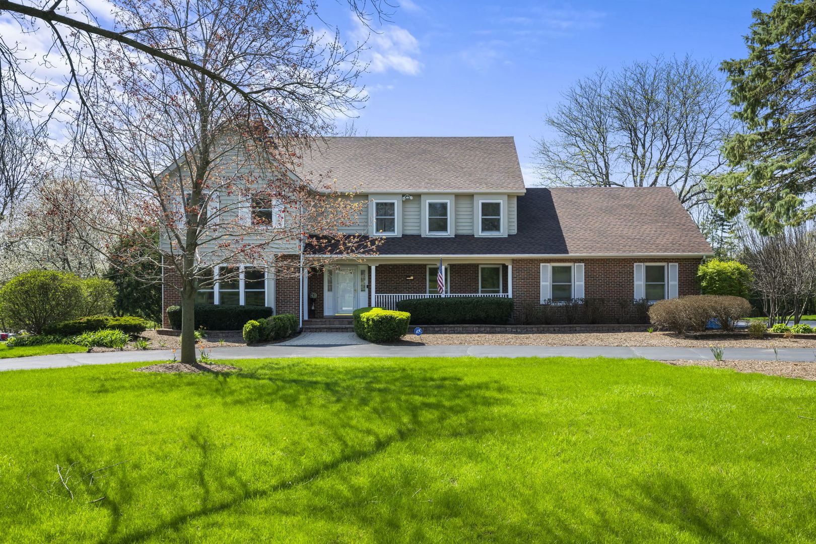 a view of a house with a yard porch and sitting area