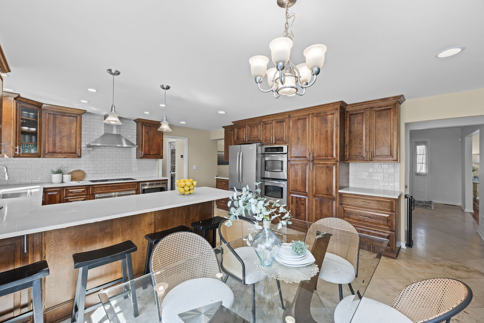26 Brandywine Road South Barrington, IL 60010 - Photo 5 of 47 a large kitchen with a table and chairs