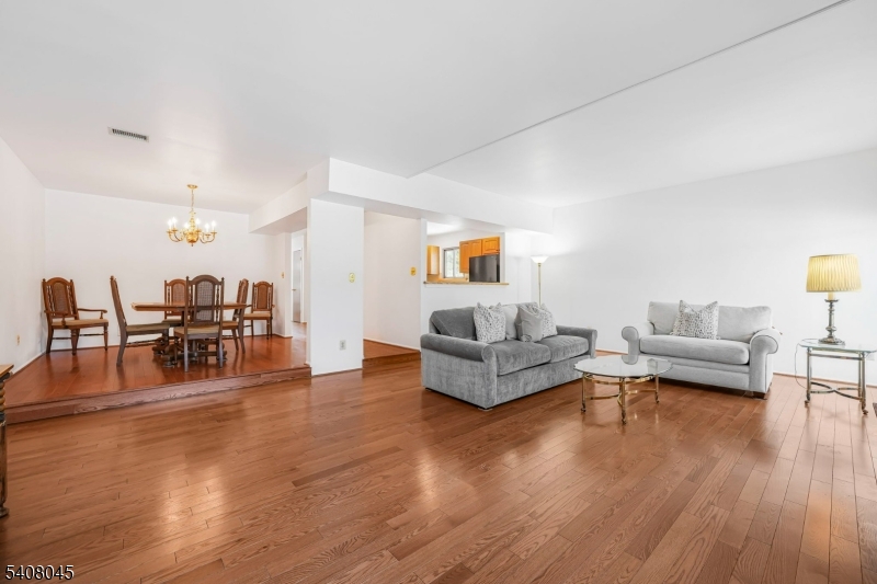 175 Castle Ridge Drive East Hanover, NJ 07936 - Photo 11 of 34 a living room with furniture and wooden floor