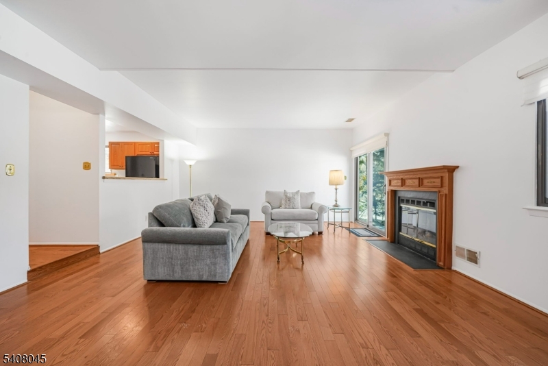 175 Castle Ridge Drive East Hanover, NJ 07936 - Photo 12 of 34 a living room with furniture and a fireplace