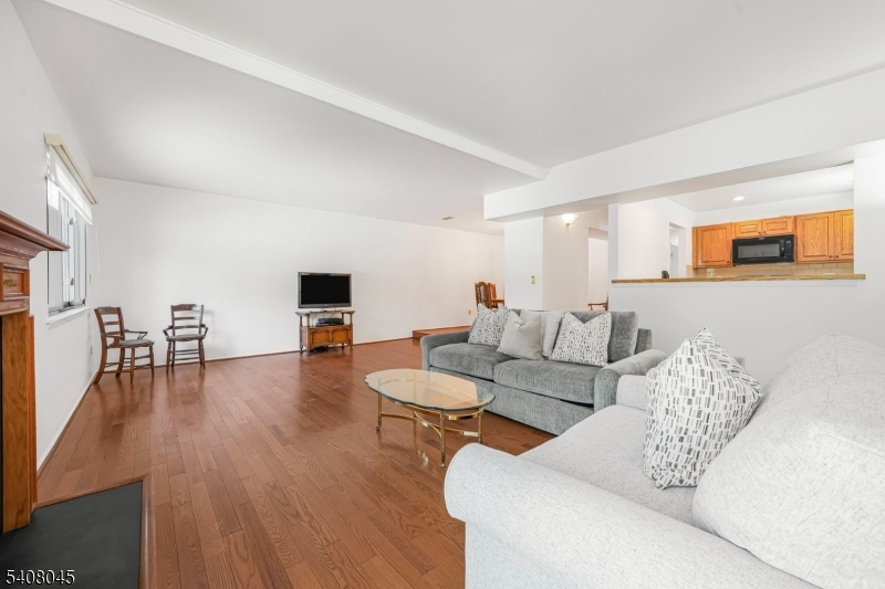 175 Castle Ridge Drive East Hanover, NJ 07936 - Photo 14 of 34 a living room with furniture and a flat screen tv