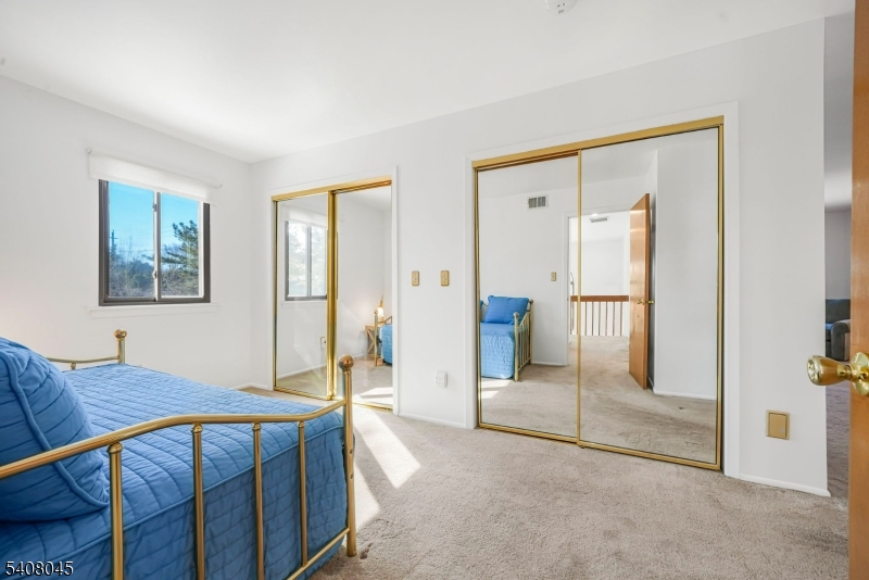 175 Castle Ridge Drive East Hanover, NJ 07936 - Photo 20 of 34 a view of a bedroom with furniture and wooden floor