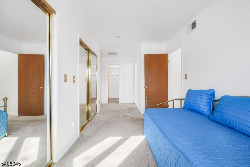 175 Castle Ridge Drive East Hanover, NJ 07936 - Photo 21 of 34 a bedroom with a bed and a view of bathroom