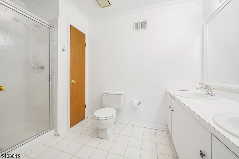 175 Castle Ridge Drive East Hanover, NJ 07936 - Photo 24 of 34 a bathroom with a sink and a mirror