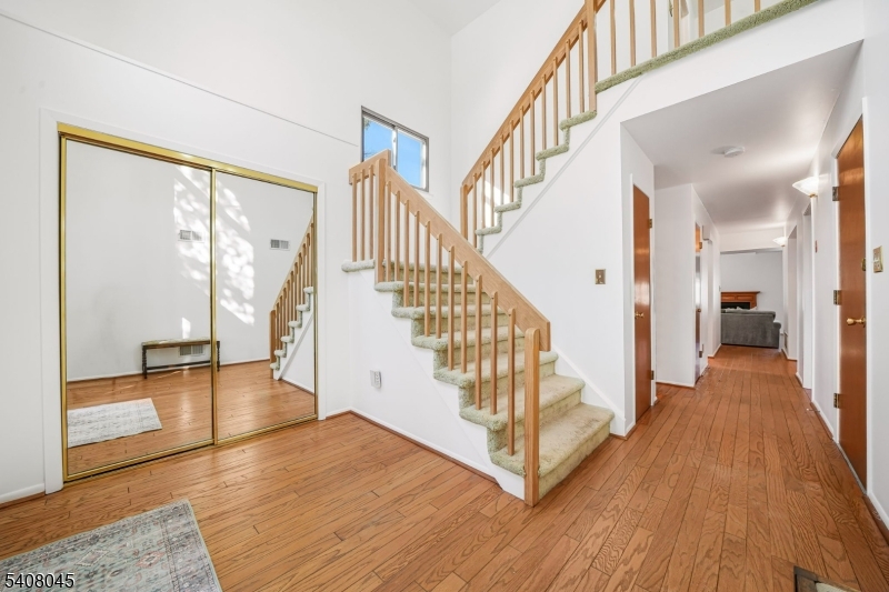 175 Castle Ridge Drive East Hanover, NJ 07936 - Photo 4 of 34 a view of an entryway with wooden floor