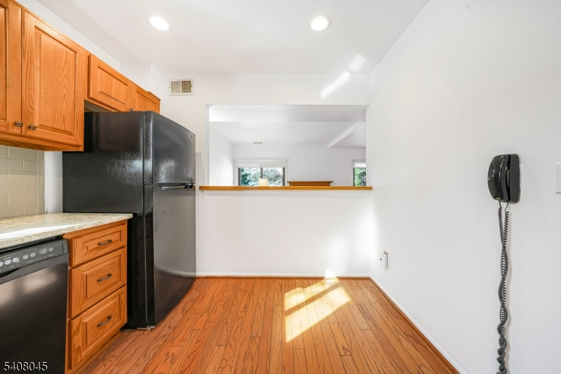 175 Castle Ridge Drive East Hanover, NJ 07936 - Photo 9 of 34 a kitchen with stainless steel appliances a refrigerator and a stove top oven