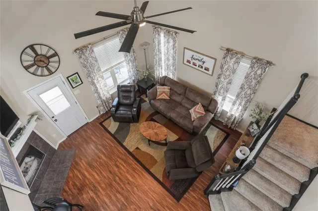 a view of a living room with furniture and a chandelier