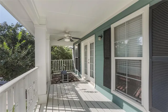 a view of a balcony with wooden floor