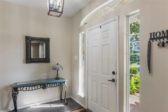 a view of a hallway with entryway door