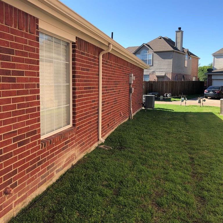 1202 Defford Lane Allen, TX 75002 - Photo 3 of 10 View of side of home featuring brick siding and a central AC unit