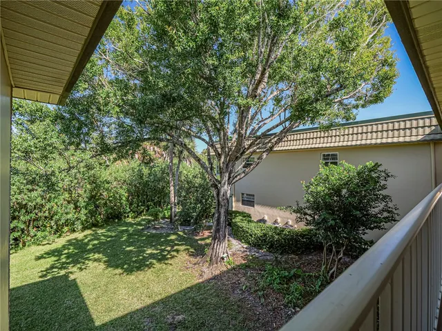 a view of a balcony with wooden fence