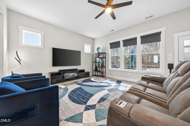 a spacious bedroom with a bed and a dresser