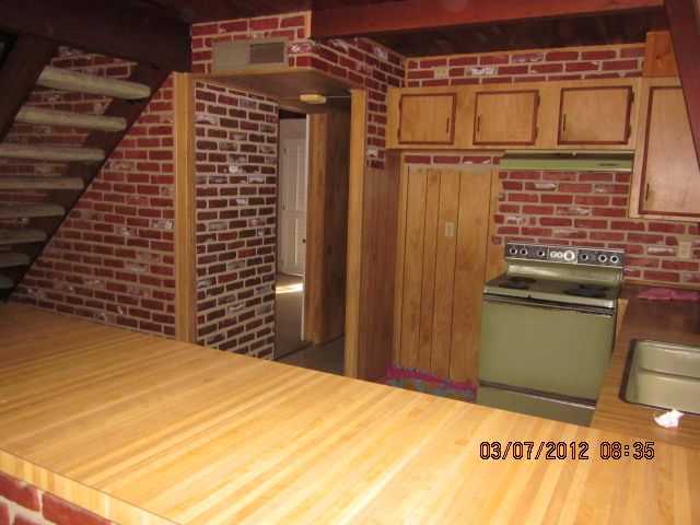 1402 Sycamore Way Fallbrook, CA 92028 - Photo 4 of 10 Open Kitchen & Great Room with Fireplace all opening to a lovely patio.