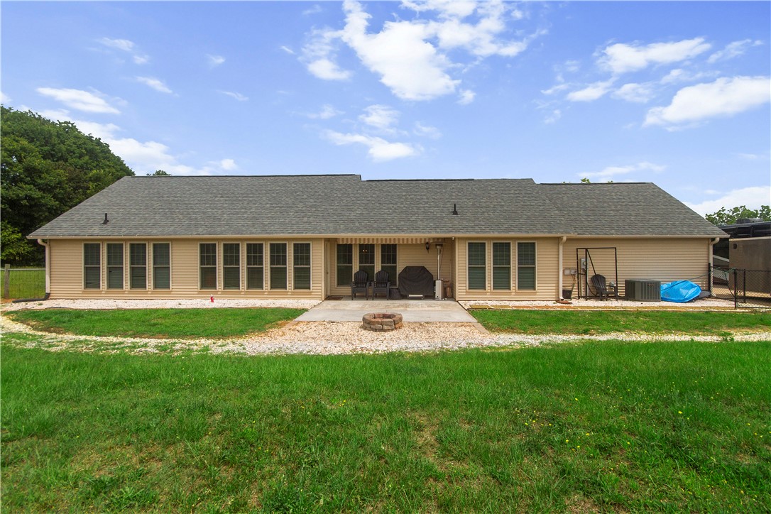 2900 Highway 187 Anderson, SC 29626 - Photo 5 of 41 A private back patio with a built-in fire pit creates an inviting outdoor living space.