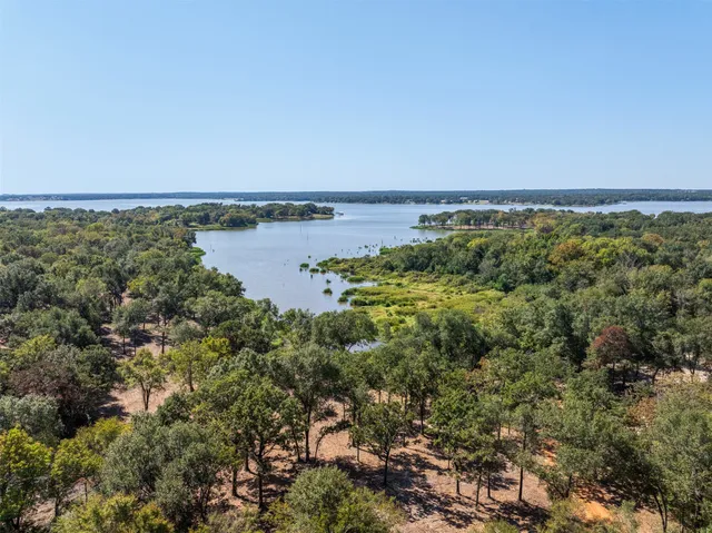 a view of a large body of water with a building in the background
