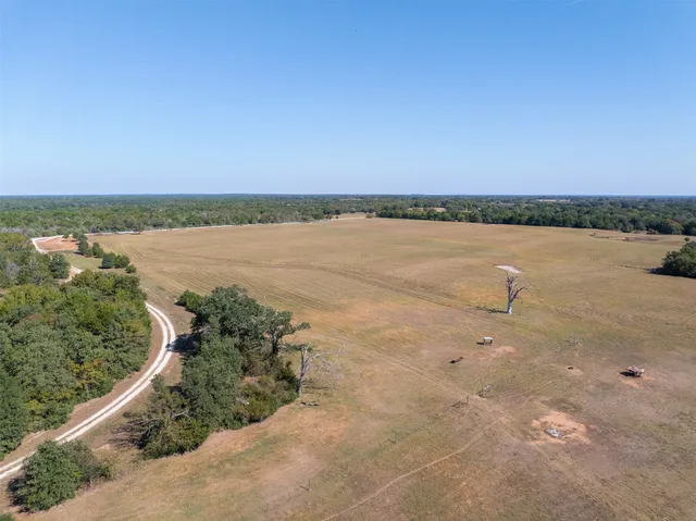 an aerial view of residential building and ocean