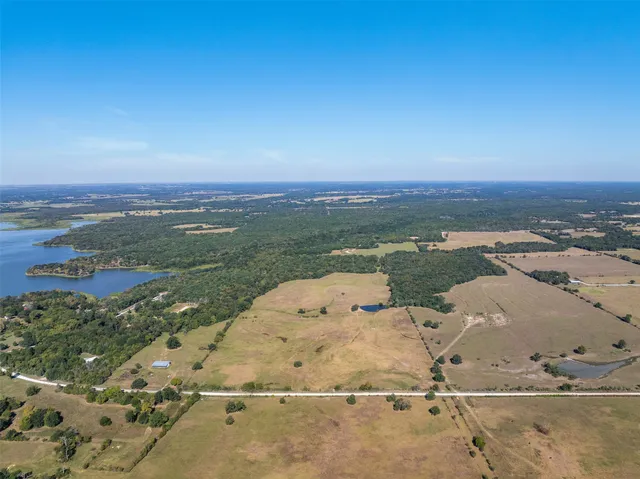 a view of a river and garden in the background