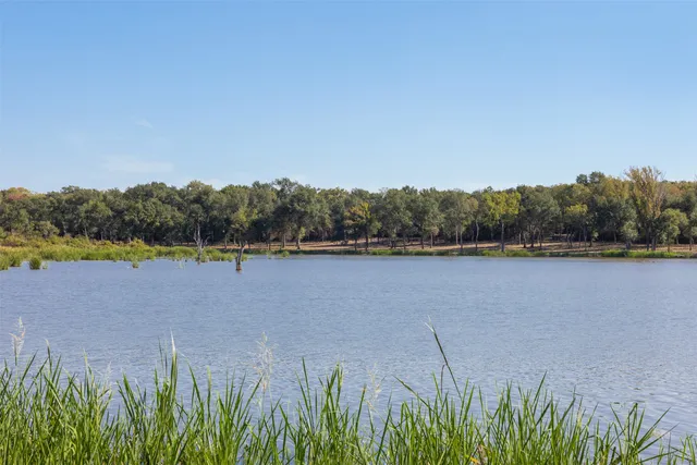 a view of lake with green space