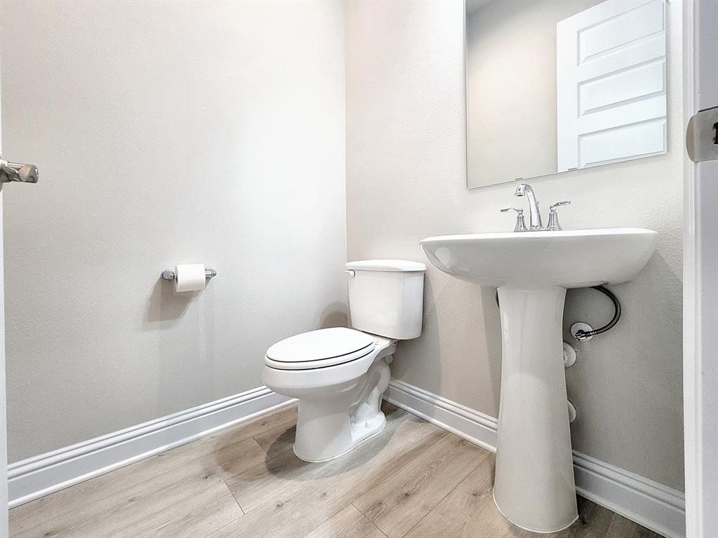 601 C-Bar Ranch Trail, Unit 14 Cedar Park, TX 78613 - Photo 9 of 22 a bathroom with a toilet sink and mirror