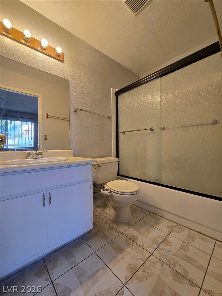 6750 Del Rey Avenue, Unit 133 Las Vegas, NV 89146 - Photo 18 of 34 A well-appointed bath features a shower, functional vanity, and tile flooring.