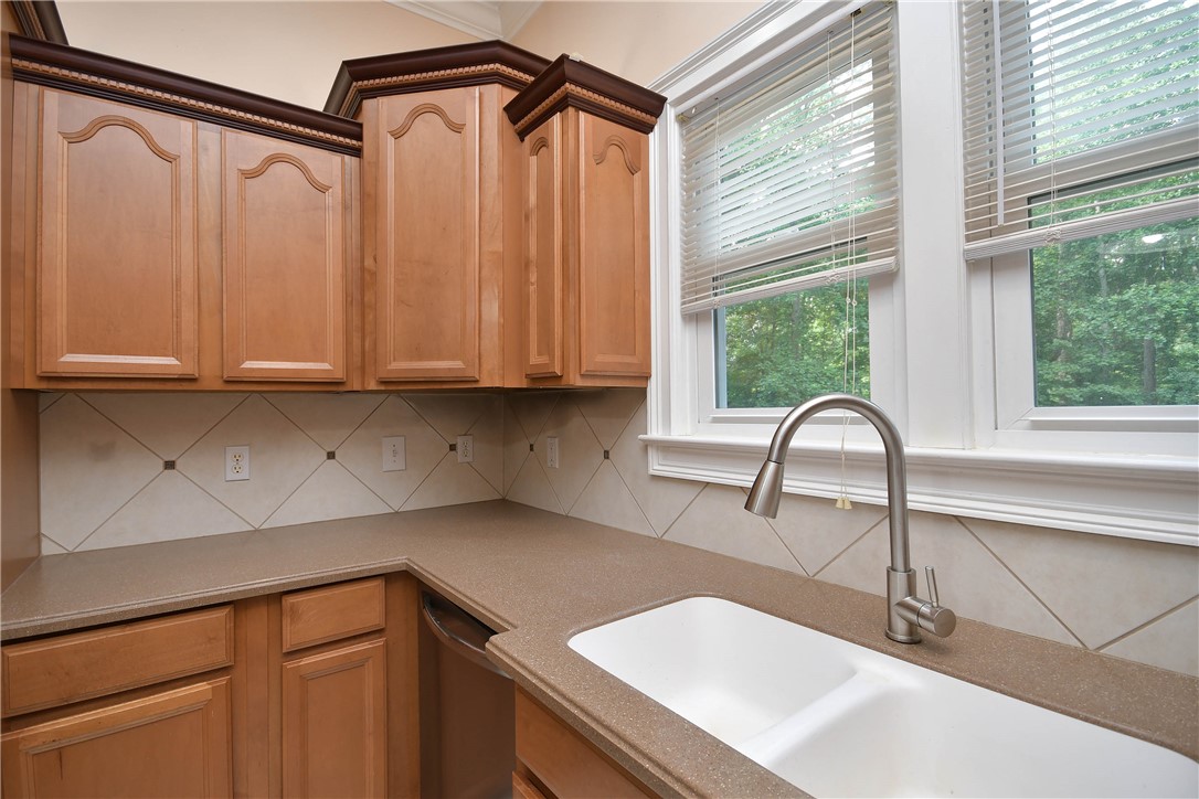197 Deer Creek Road Easley, SC 29640 - Photo 14 of 50 A well-appointed kitchen features ample cabinetry and a bright window overlooking verdant surroundings.
