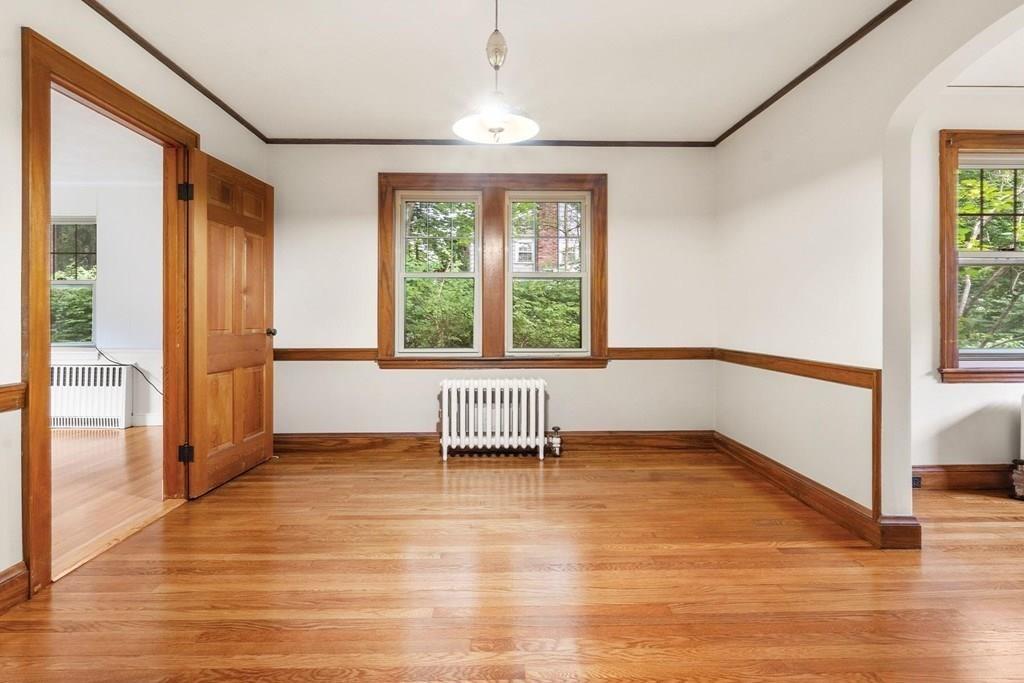 30 Pine Plain Road Wellesley, MA 02481 - Photo 11 of 27 a view of an empty room with a window and wooden floor