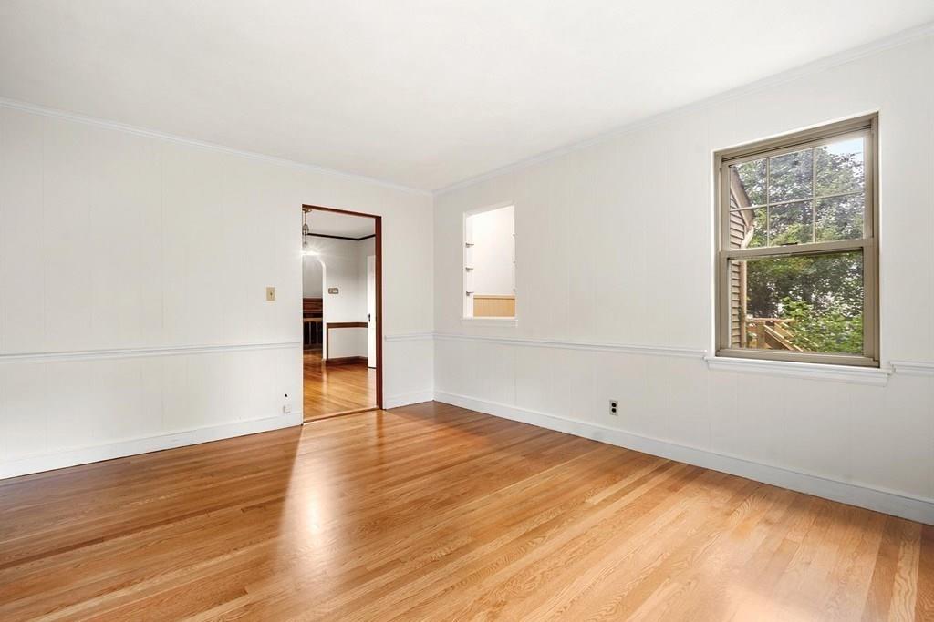 30 Pine Plain Road Wellesley, MA 02481 - Photo 16 of 27 an empty room with wooden floor and windows
