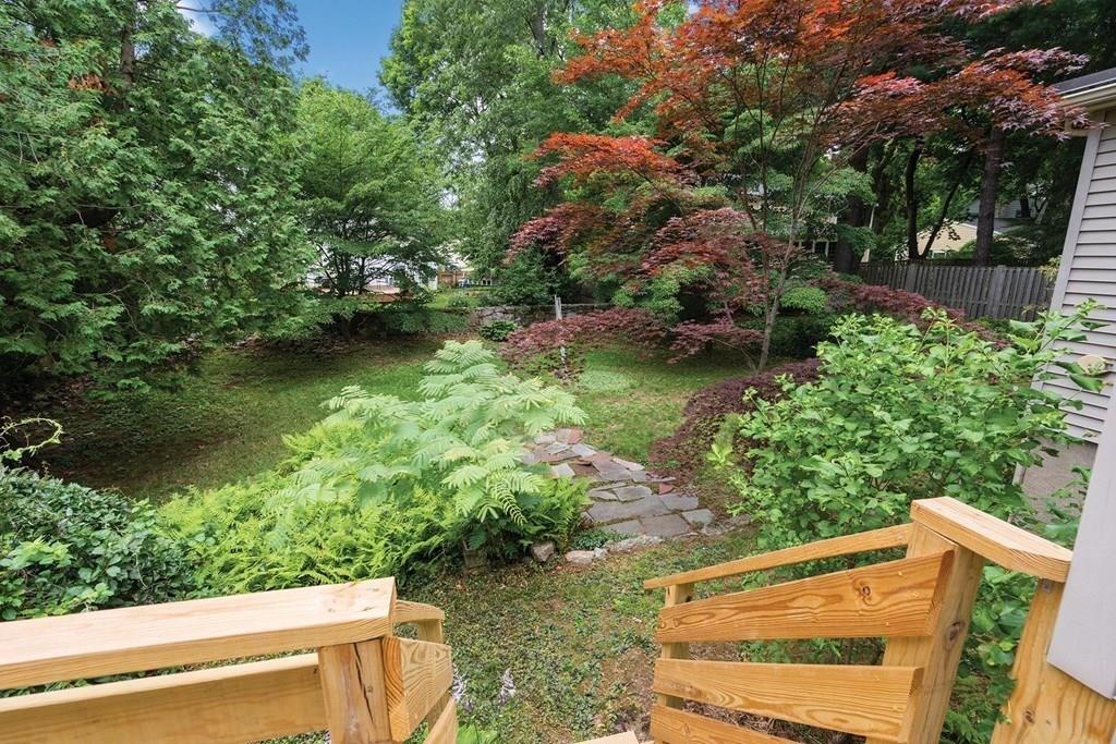 30 Pine Plain Road Wellesley, MA 02481 - Photo 22 of 27 a view of a back yard of the house and green space