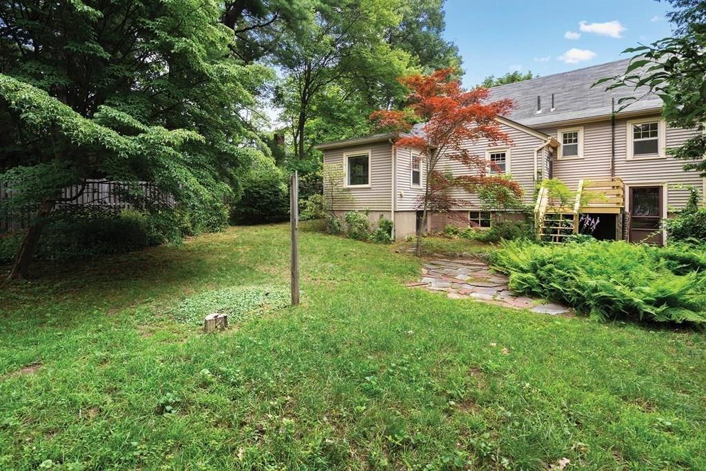 30 Pine Plain Road Wellesley, MA 02481 - Photo 24 of 27 a backyard of a house with plants and large trees