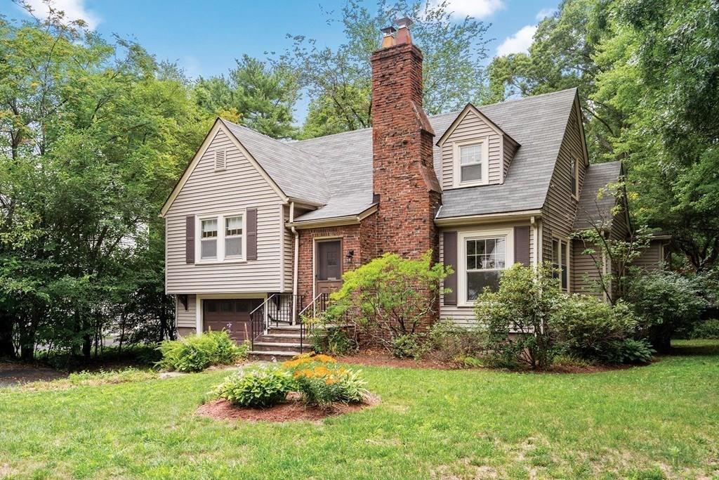 30 Pine Plain Road Wellesley, MA 02481 - Photo 25 of 27 a front view of a house with a garden and plants