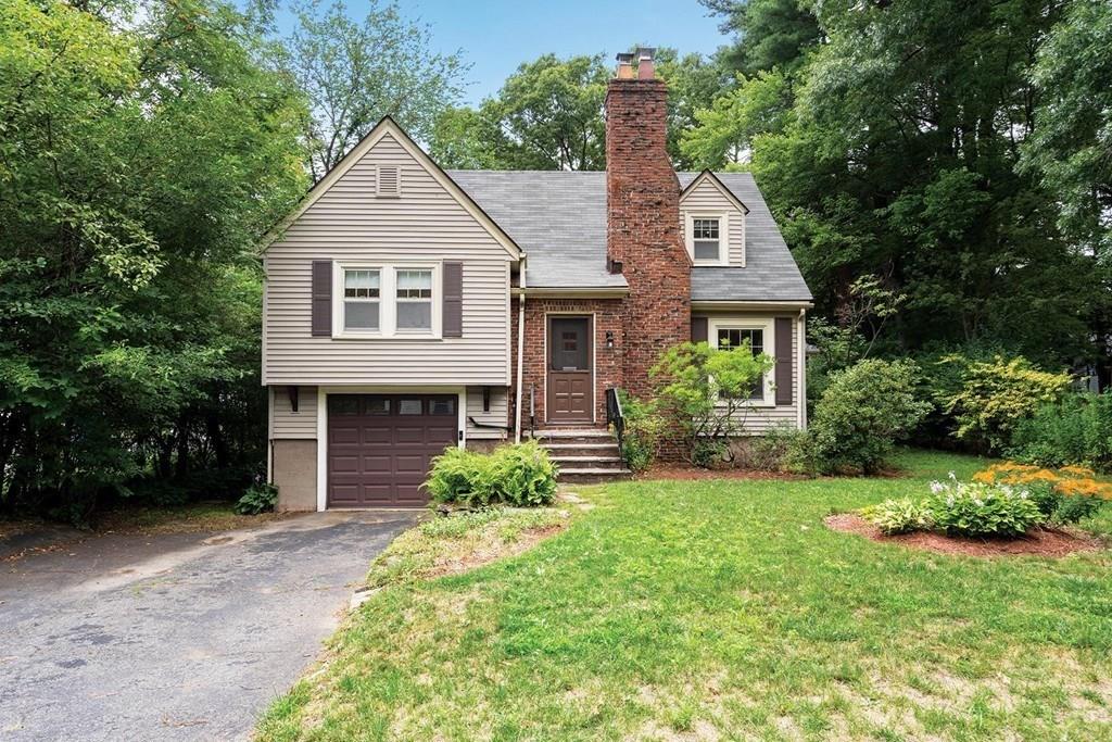 30 Pine Plain Road Wellesley, MA 02481 - Photo 26 of 27 a front view of a house with a yard and garage