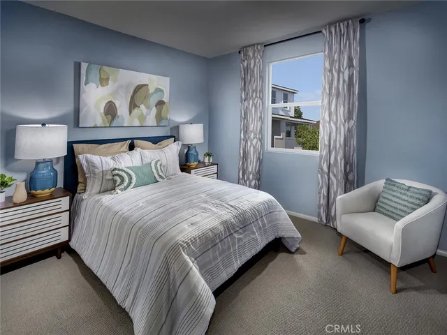 a bedroom with bed and a couch