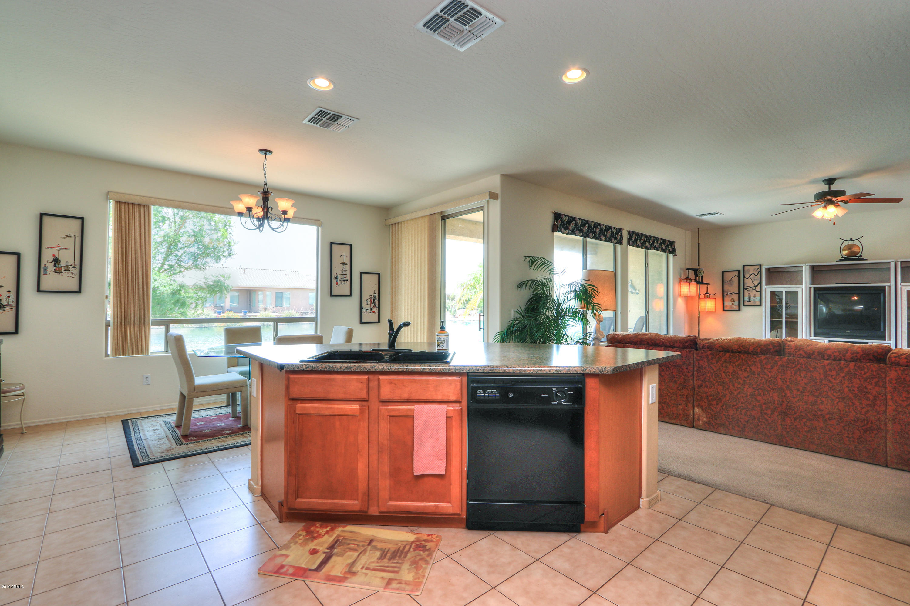 42485 Abbey Road Maricopa, AZ 85138 - Photo 17 of 74 a kitchen with granite countertop a sink and cabinets