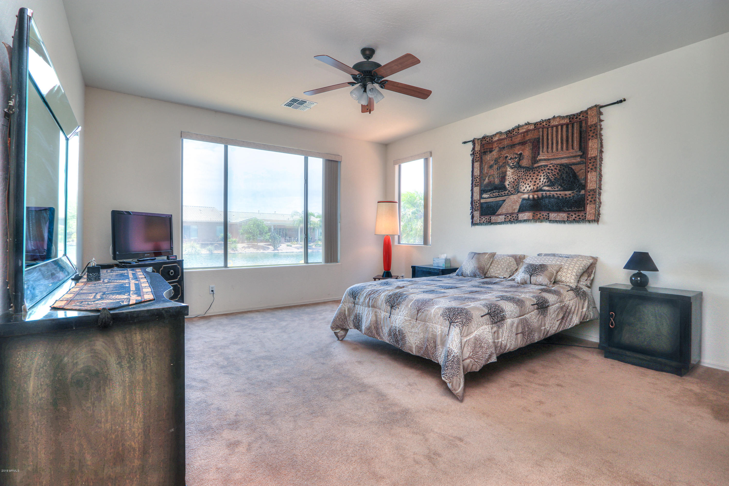 42485 Abbey Road Maricopa, AZ 85138 - Photo 28 of 74 a bedroom with bed and window