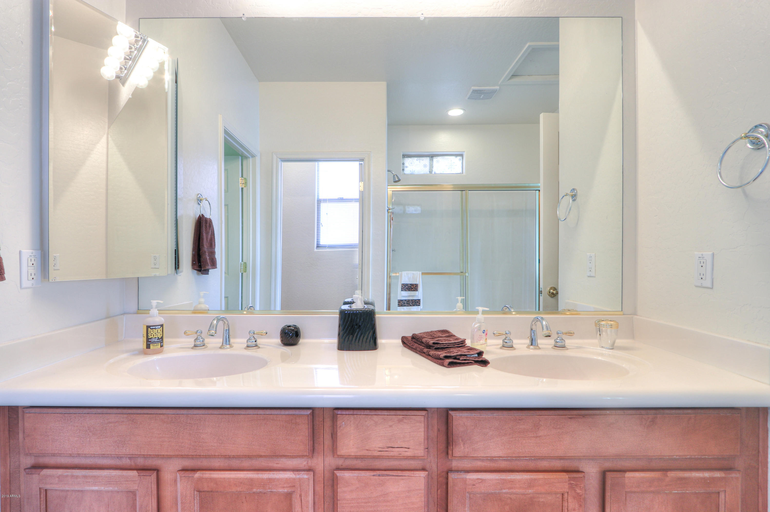 42485 Abbey Road Maricopa, AZ 85138 - Photo 33 of 74 a bathroom with a sink and a mirror