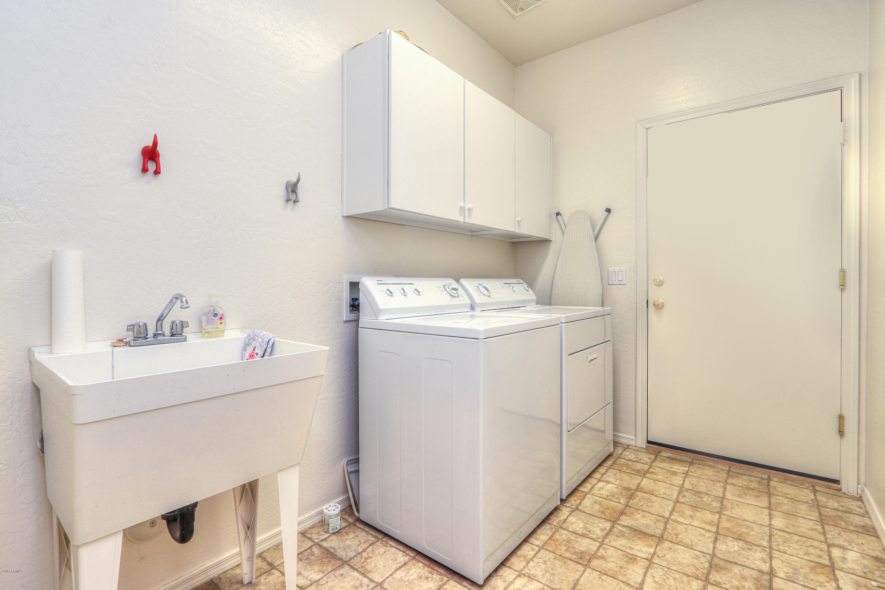 42485 Abbey Road Maricopa, AZ 85138 - Photo 38 of 74 a utility room with sink dryer and washer