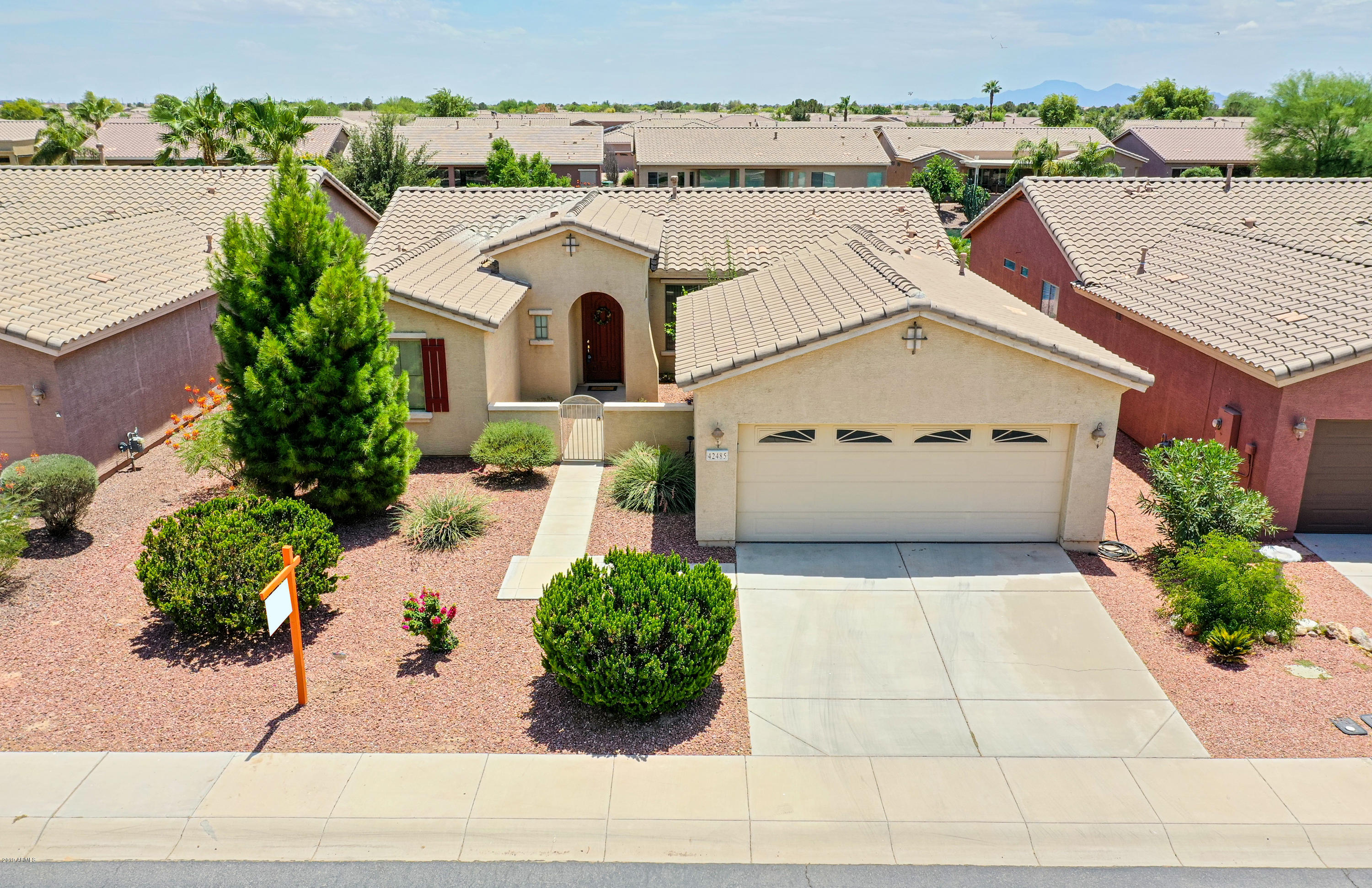 42485 Abbey Road Maricopa, AZ 85138 - Photo 4 of 74 a white building with a outdoor space