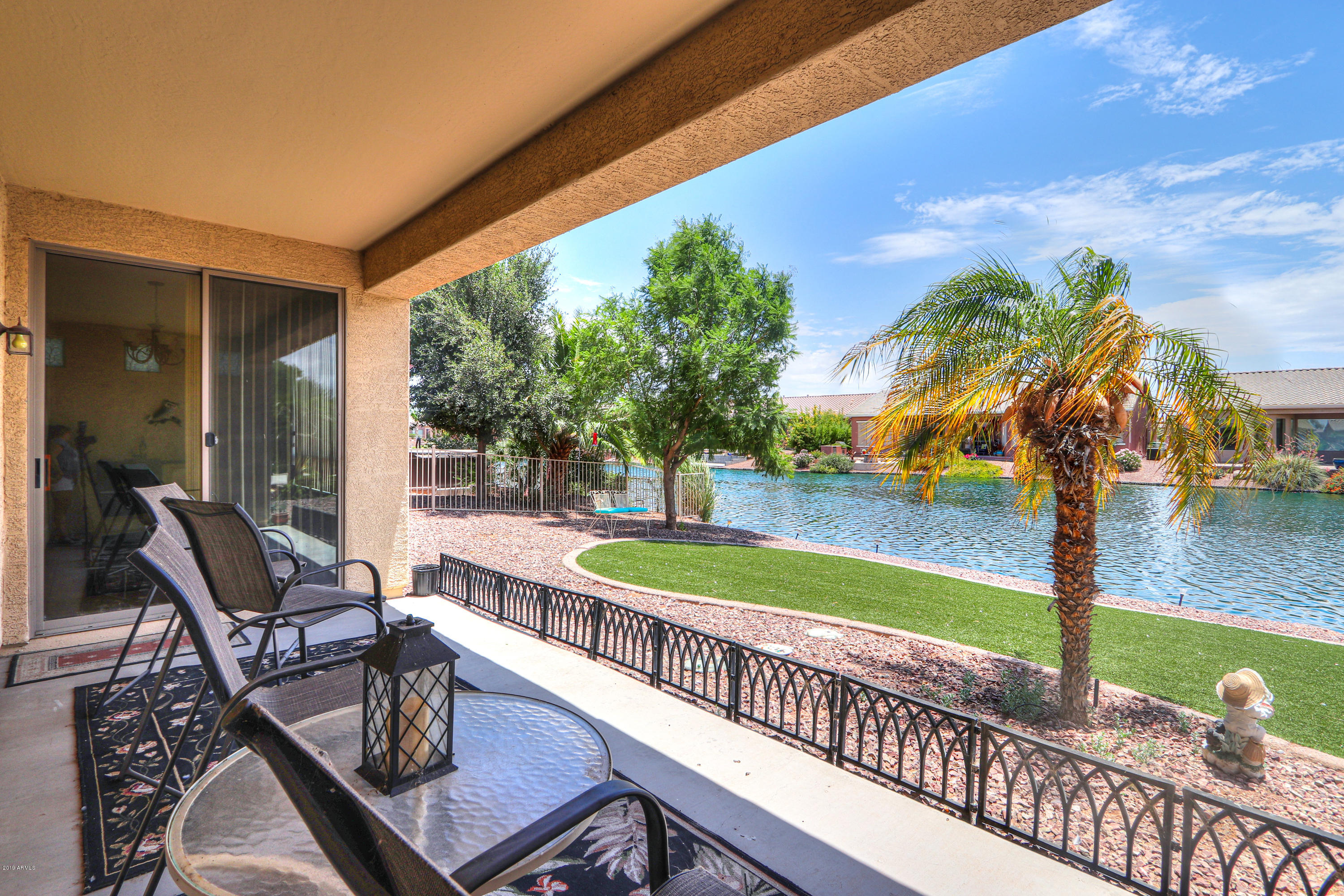 42485 Abbey Road Maricopa, AZ 85138 - Photo 45 of 74 a view of a swimming pool with a patio and a yard