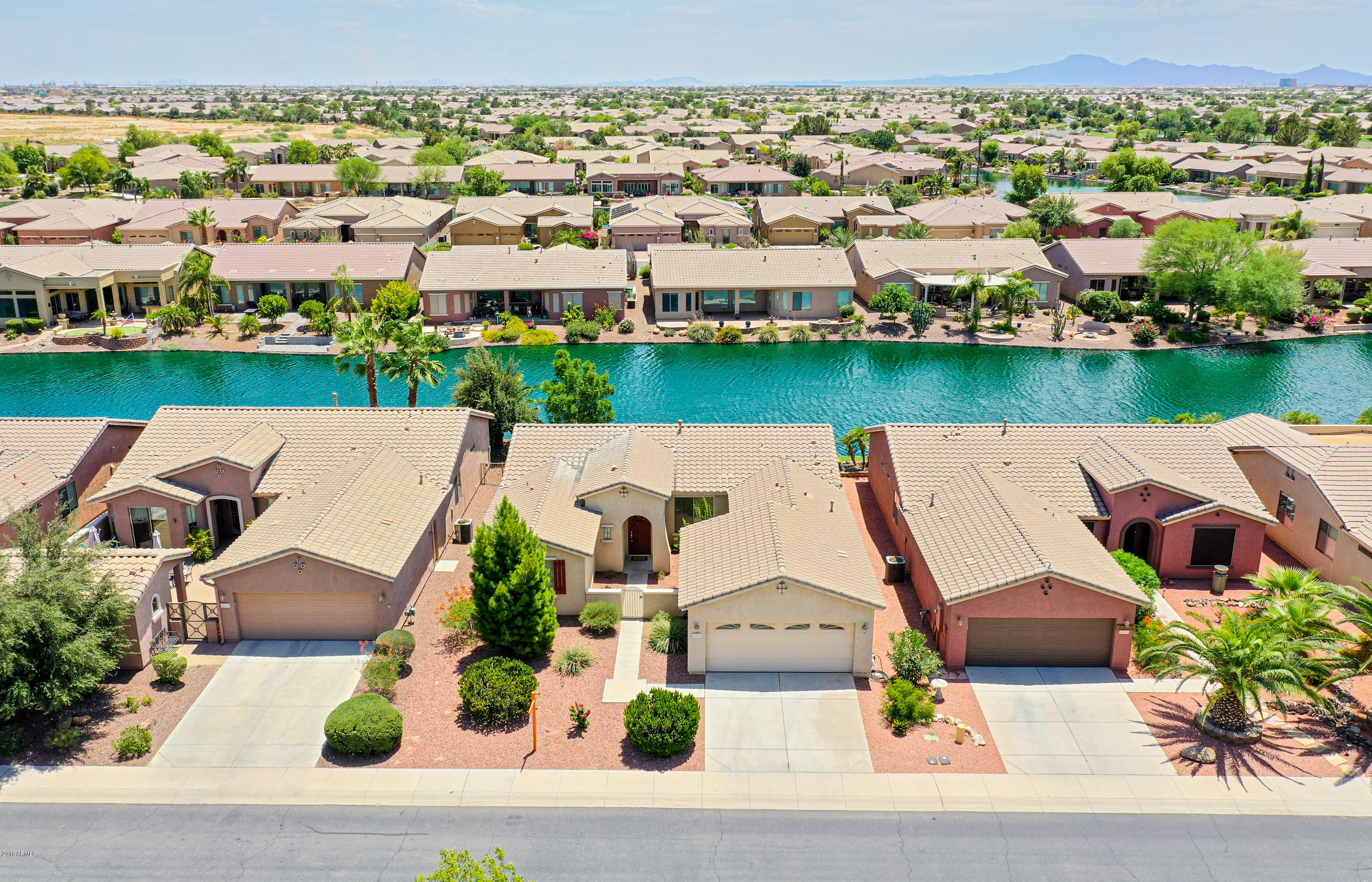 42485 Abbey Road Maricopa, AZ 85138 - Photo 57 of 74 an aerial view of a house with garden space and lake view