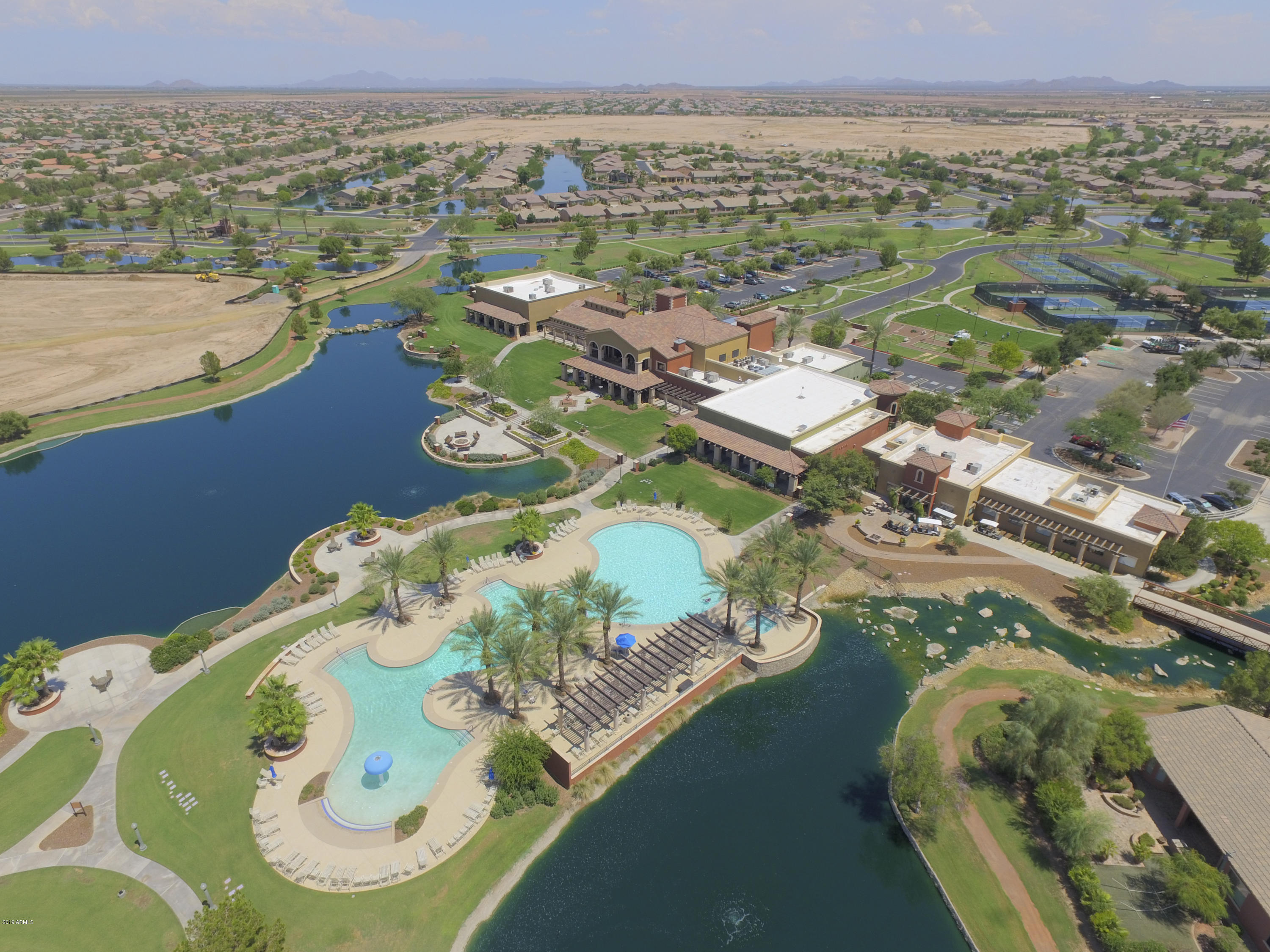 42485 Abbey Road Maricopa, AZ 85138 - Photo 64 of 74 an aerial view of a house a yard and lake view
