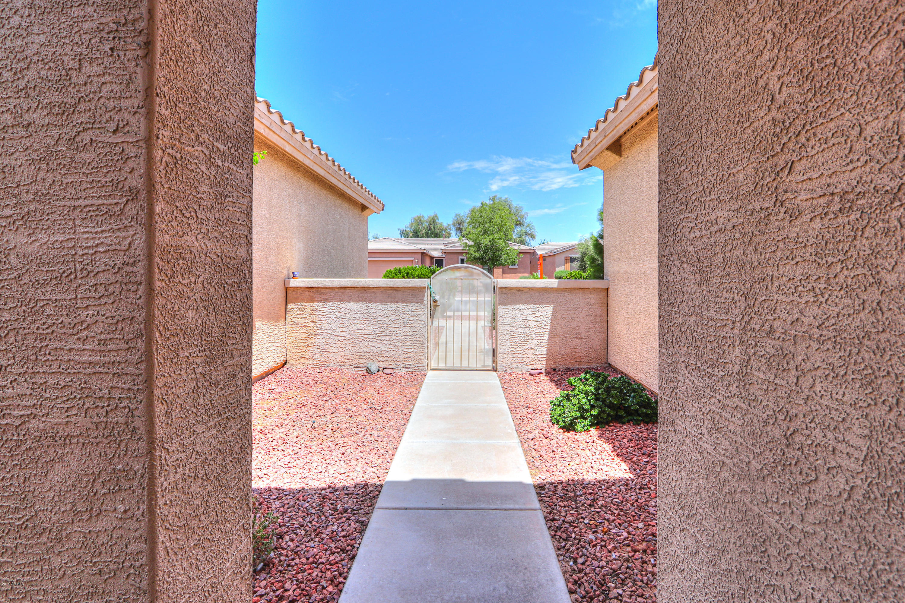 42485 Abbey Road Maricopa, AZ 85138 - Photo 8 of 74 a view of a backyard with sitting area